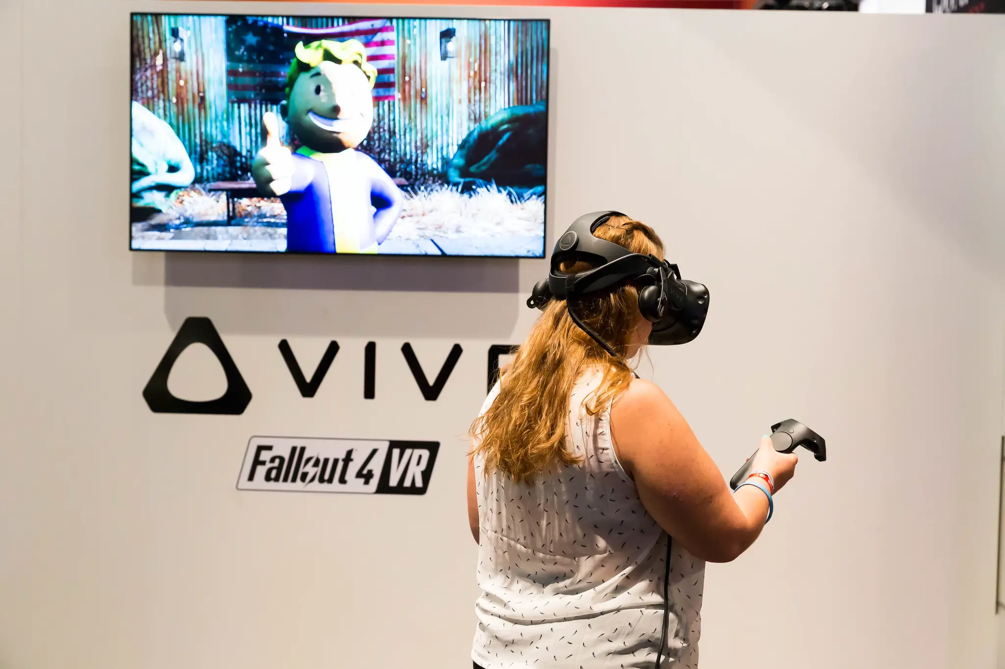 woman in blonde wearing vr while standing